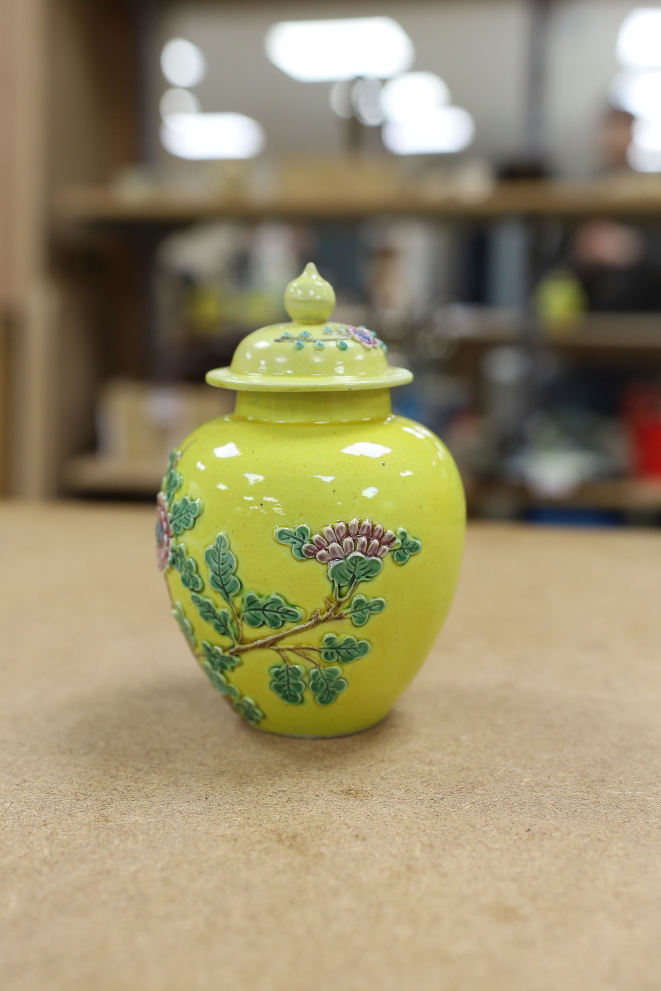 A Chinese enamelled yellow-ground jar and cover, a pottery teapot and cover and a flambe vase, latter 13cm